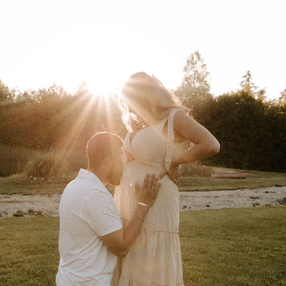 Outdoor maternity photoshoot during golden hour in New Hampshire.