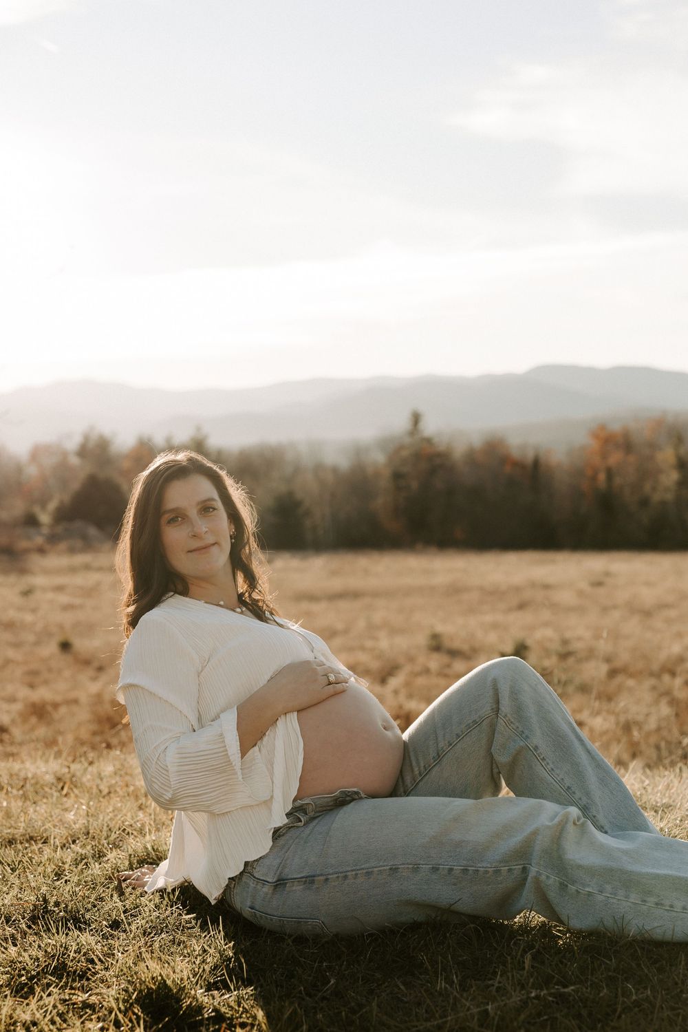 Outdoor maternity photoshoot during golden hour in New Hampshire.