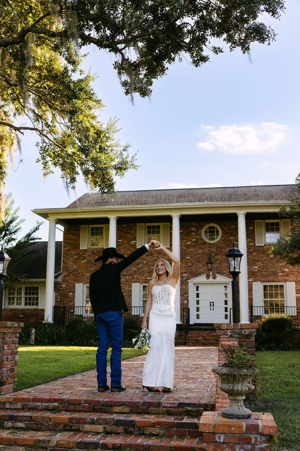 A panoramic view of a brick ranch-style house with white columns and a covered porch at different angles.