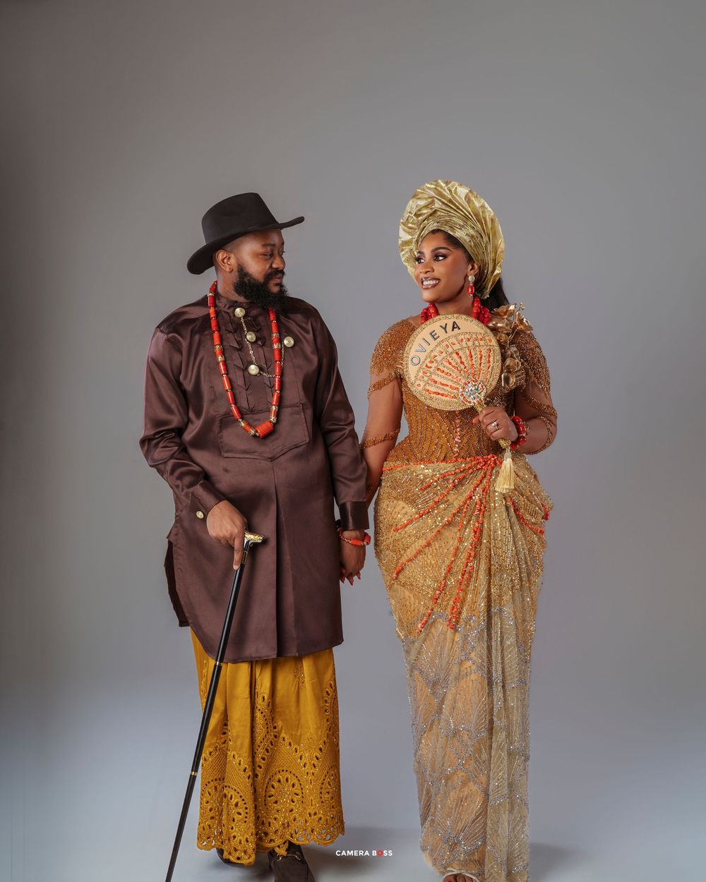 Traditional Navajo figures in ceremonial dress pose in a series of artistic studio portraits against a gray backdrop.