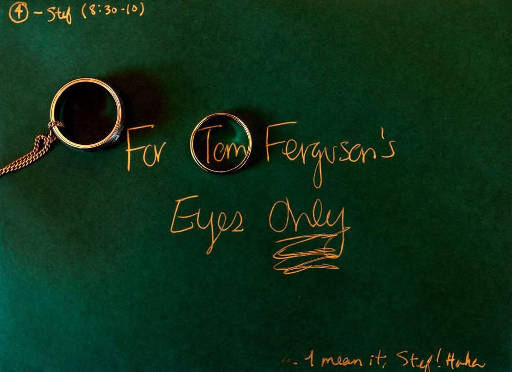 Handwritten yellow text glows against a dark green chalkboard background with multiple lines of writing.