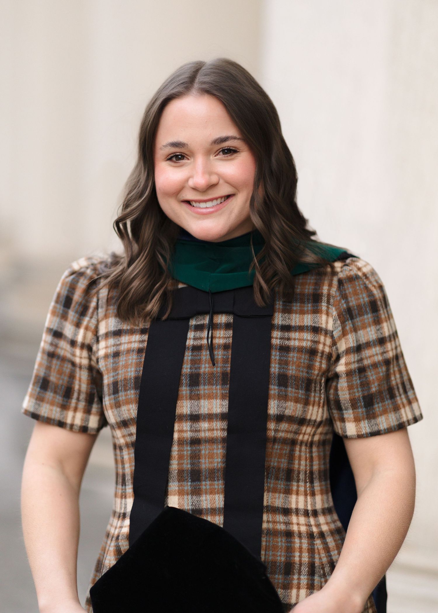 A series of portraits showing someone wearing a brown plaid shirt and black overalls against a light background.
