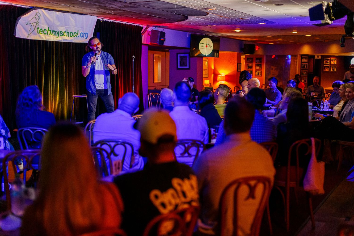 Comedian on stage at a comedy show. San Juan, Puerto Rico.