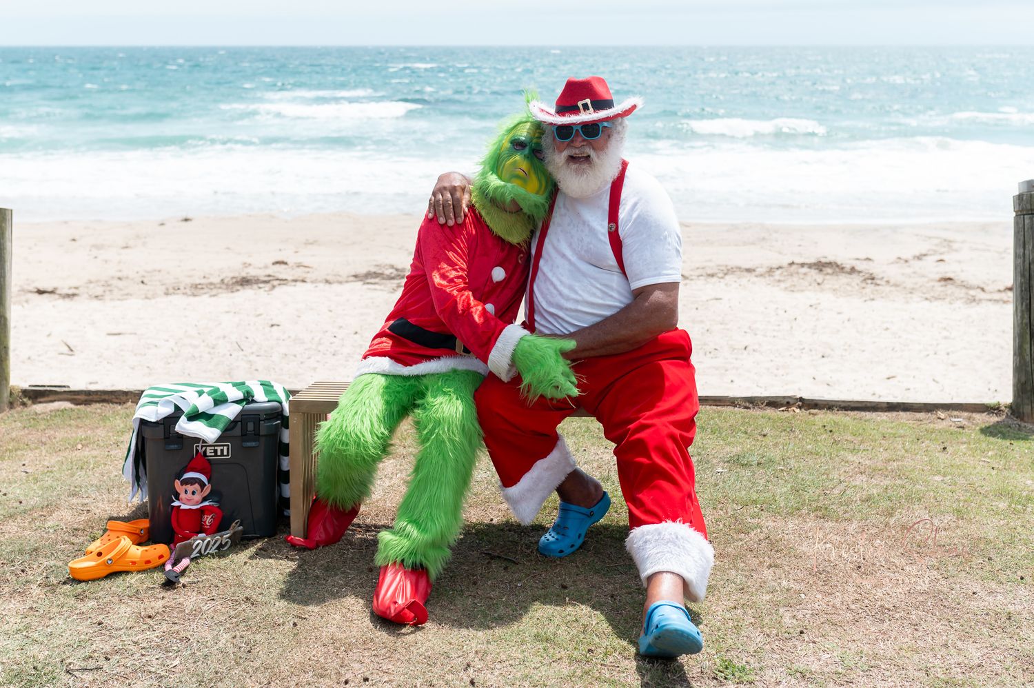 Holiday-themed gathering at oceanside with inflatable tube and beachwear.