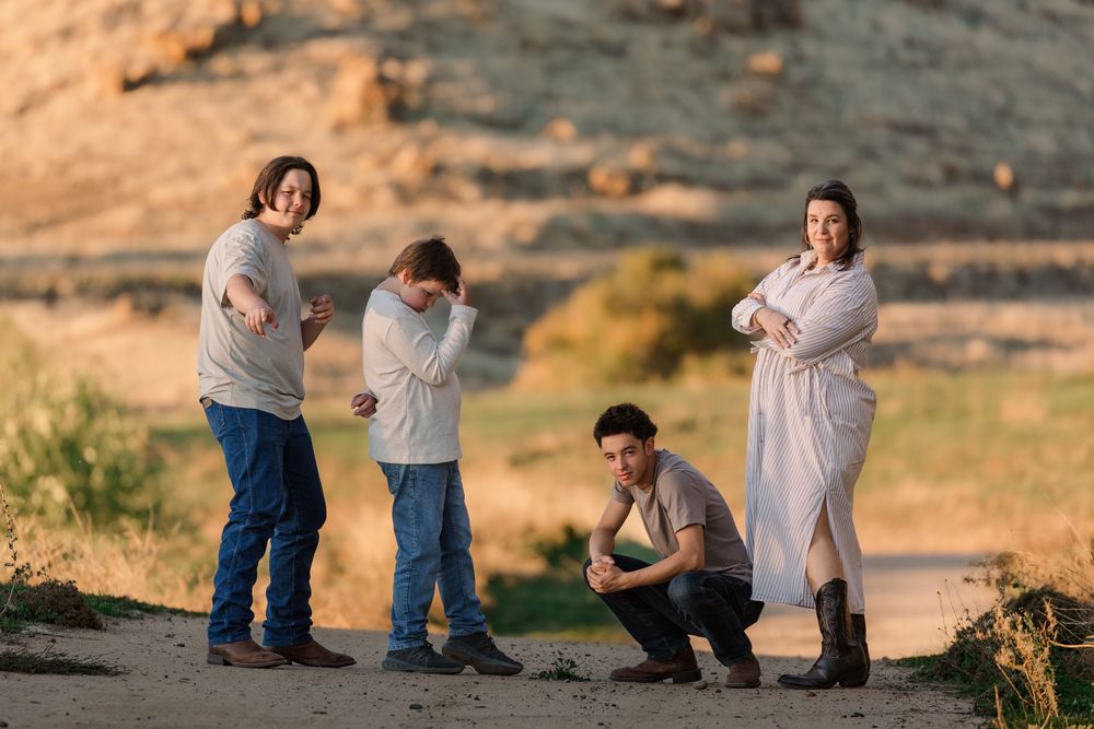 Candid family moments photographed against a desert backdrop during golden hour.