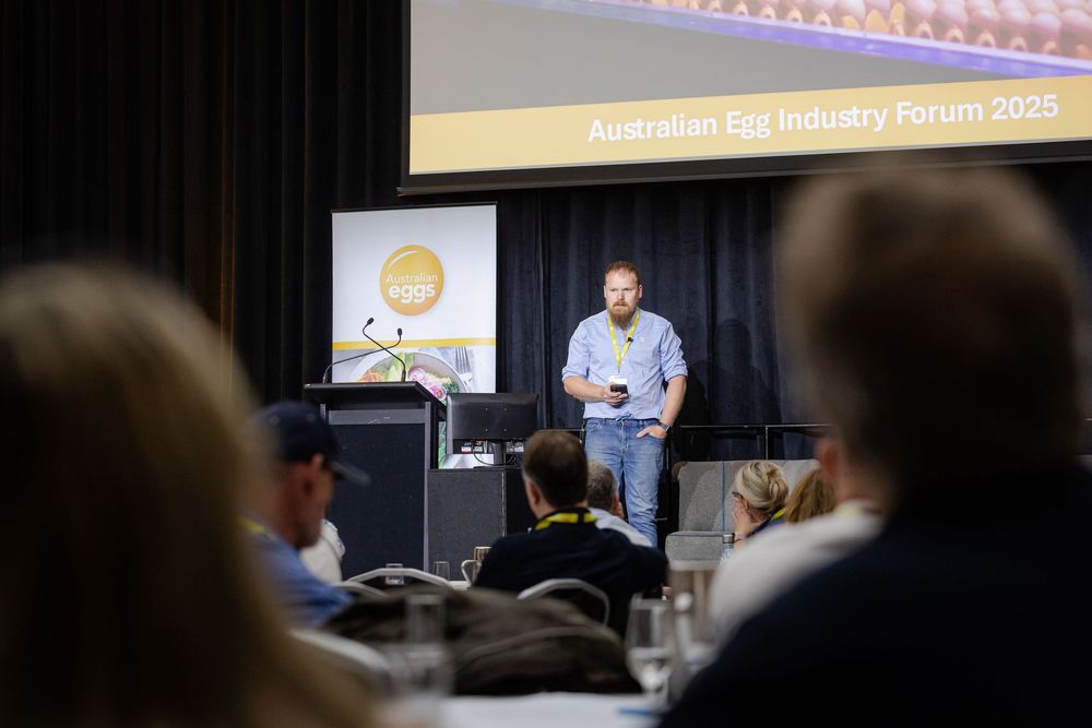 Conference attendees listen intently to a presentation and photographed by a Freo Conference Photographer