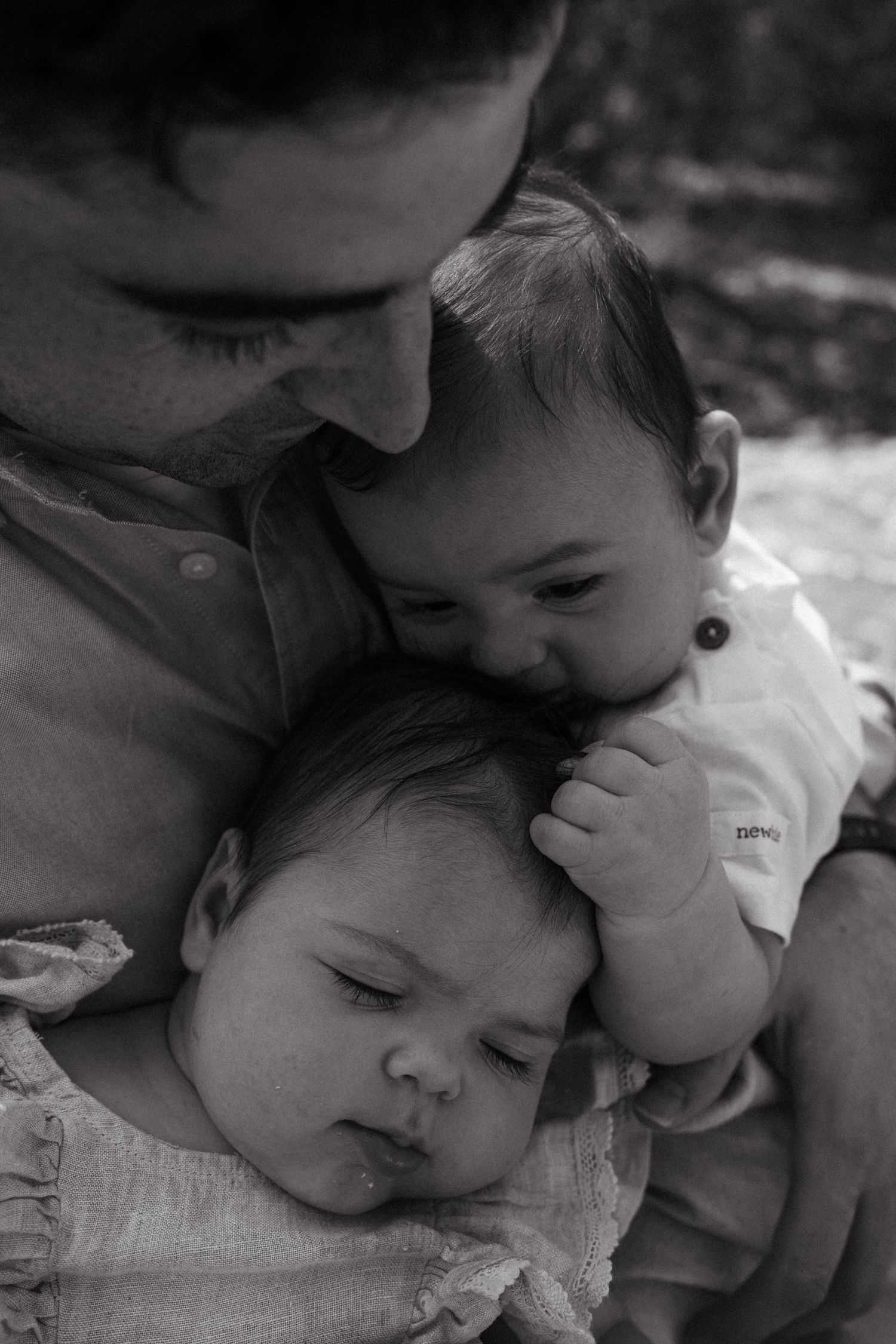 Black and white intimate portrait of tender mother and baby moment.