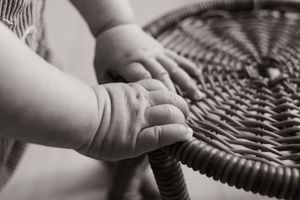 detail black and white hands shot during milestone session christchurch
