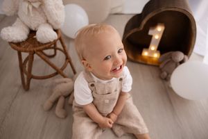 Milestone session at Bishopdale studio, toddler smiling