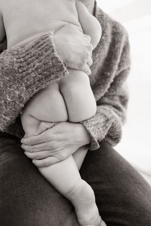 Milestone session in the Bishopdale studio, christchurch. Mum holding baby
