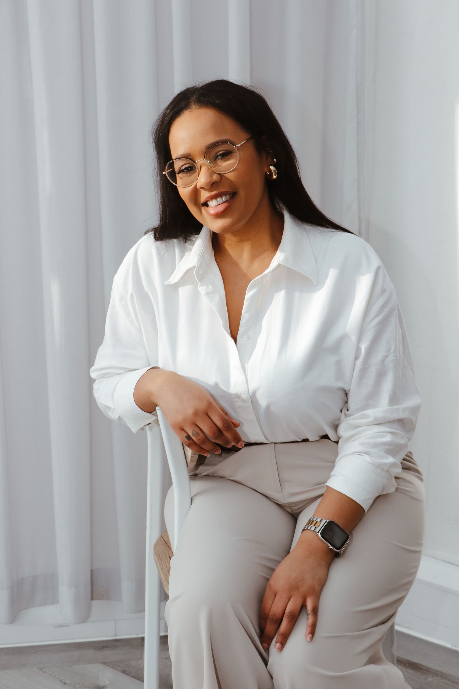 A series of candid photos showing someone in white clothing sitting casually on a light-colored couch.