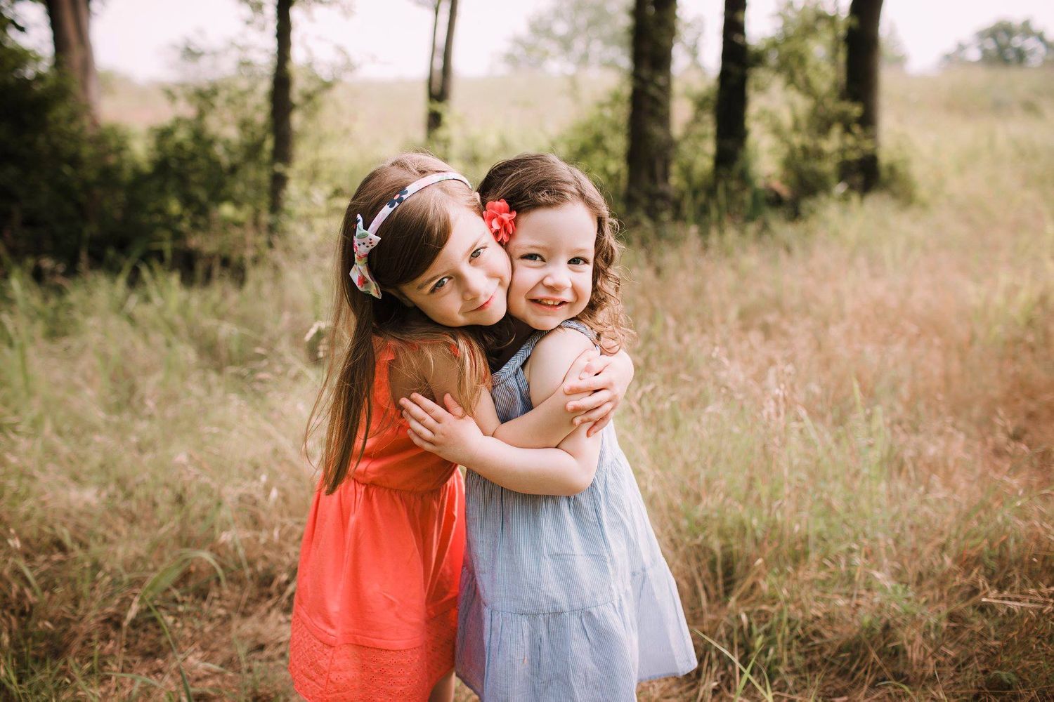 Family hugging during fall photography session in Springfield MO.