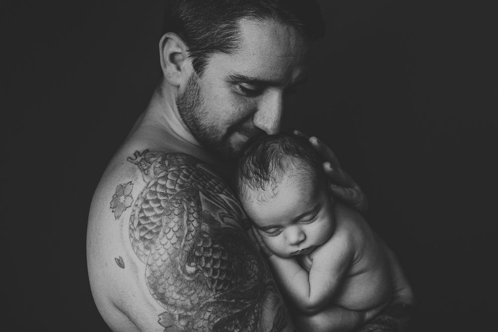 Black and white photo series showing intimate moments between two people in close embrace and tender poses.