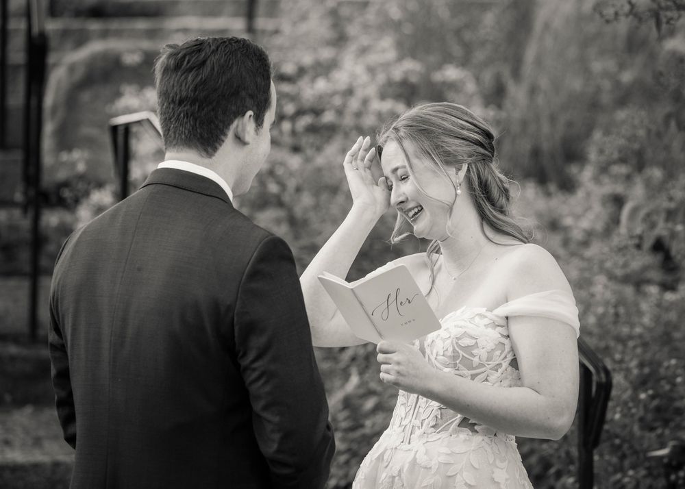 Black and white wedding photos showing intimate moments between newlyweds in a garden setting.