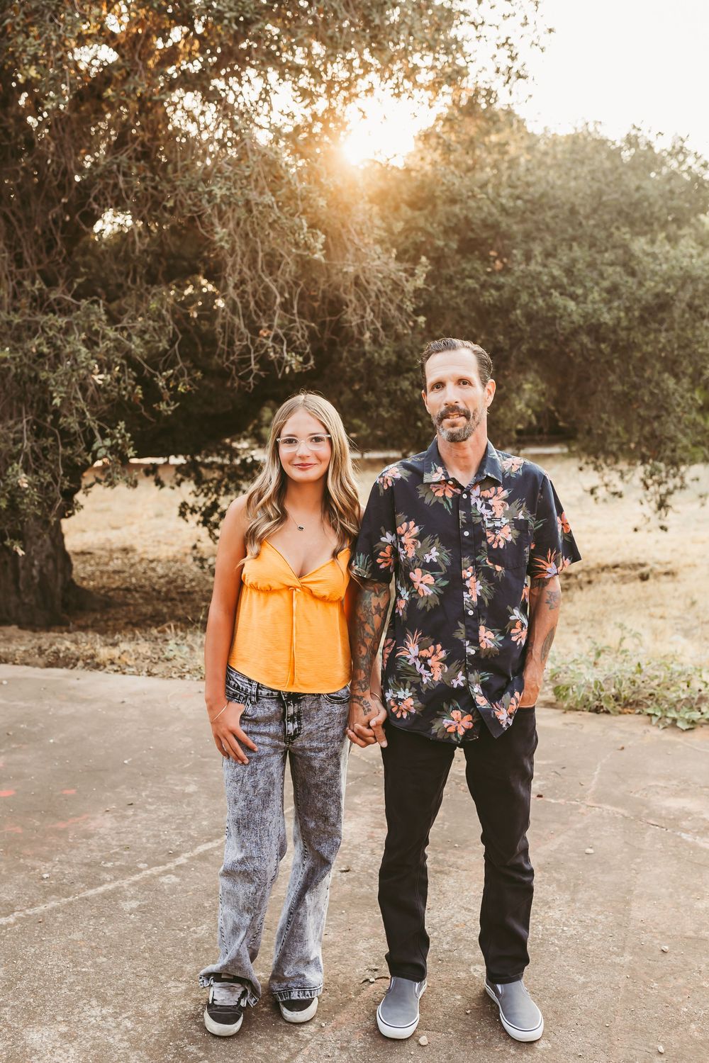 A series of casual outdoor photos showing two people posing together on a path at sunset in summer attire.
