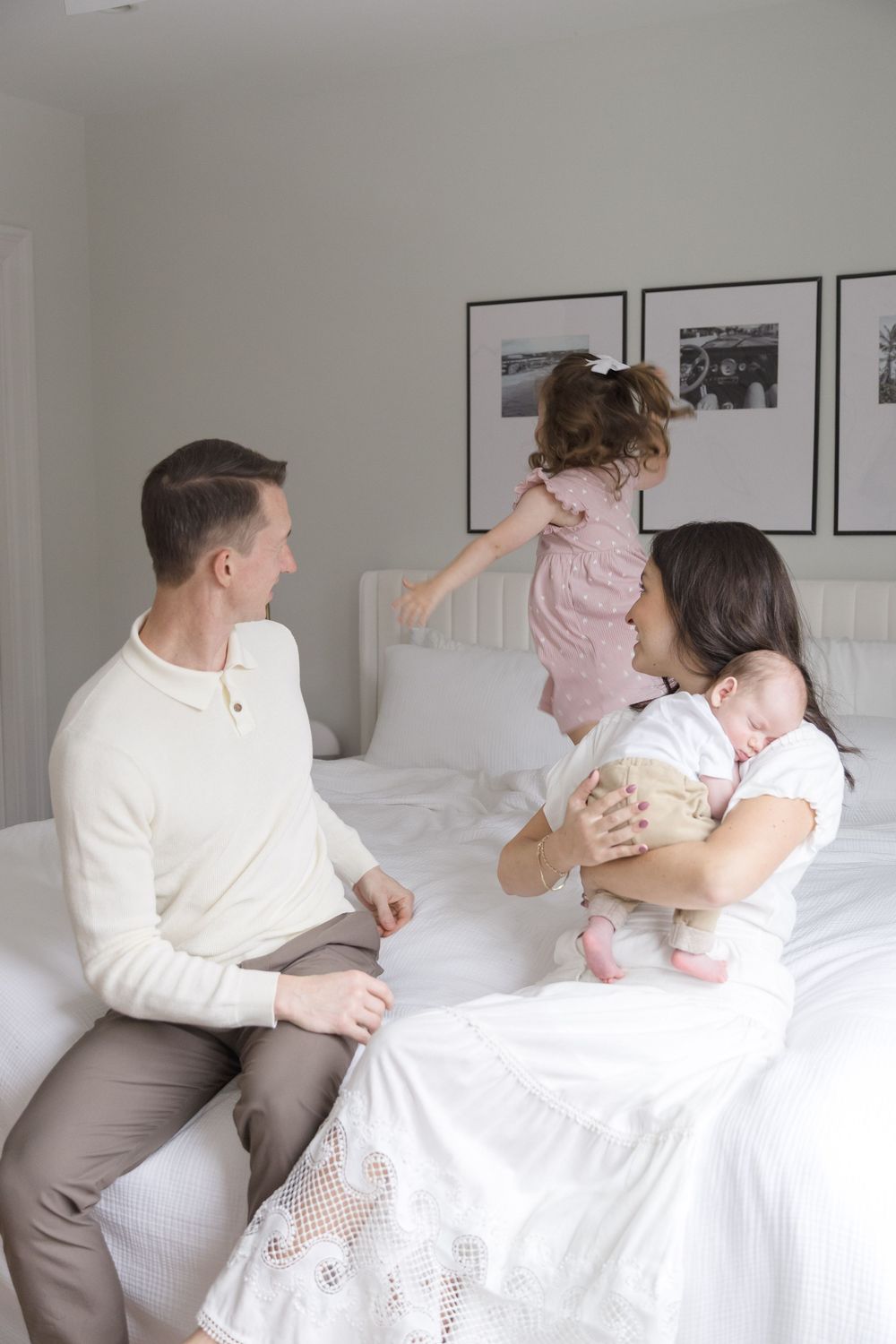 "Family being playful with newborn and toddler during in-home lifestyle photo session in Glover Park, Washington DC."