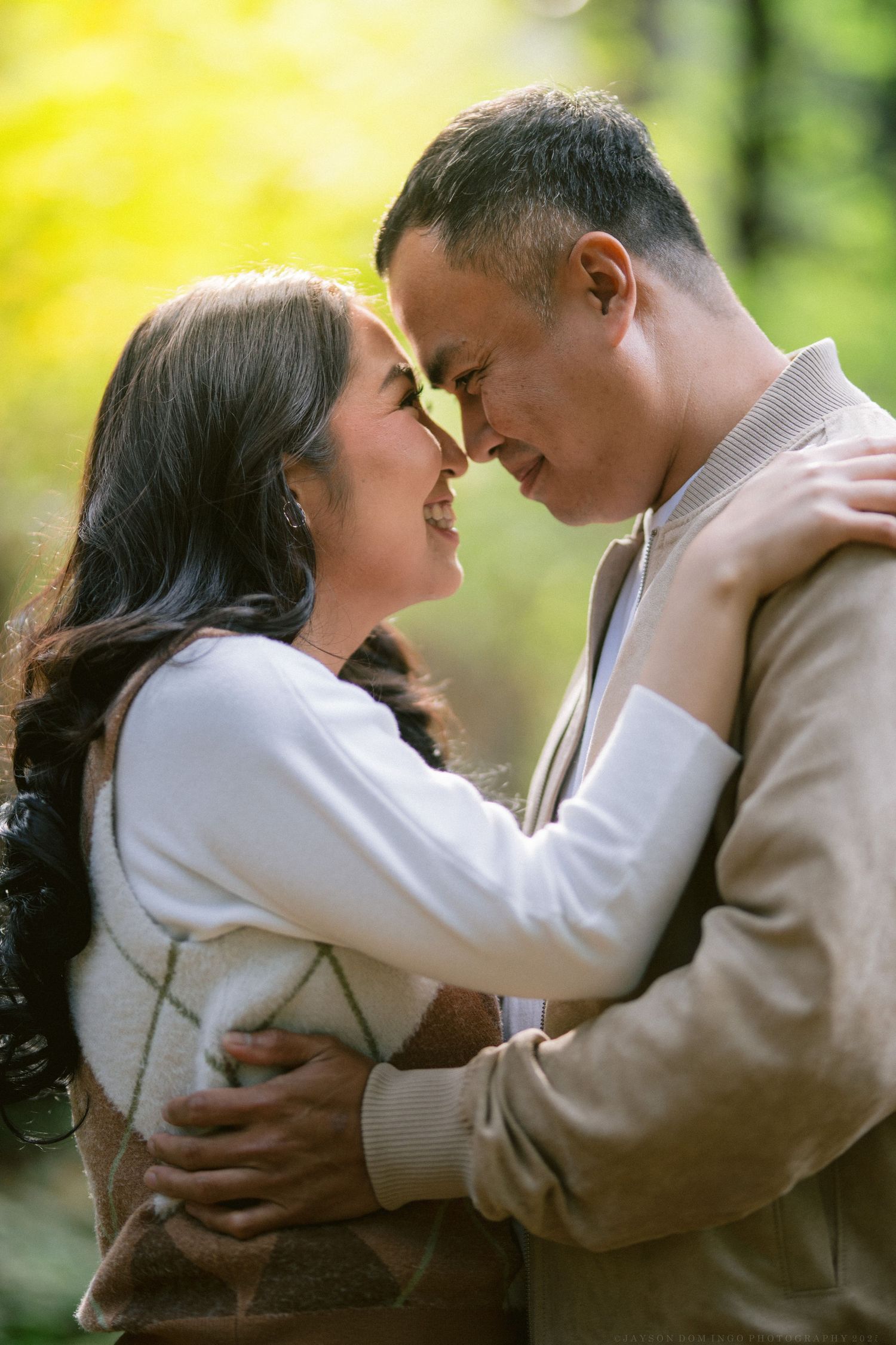 A romantic couple in warm sweaters share tender moments outdoors in a series of intimate embraces.
