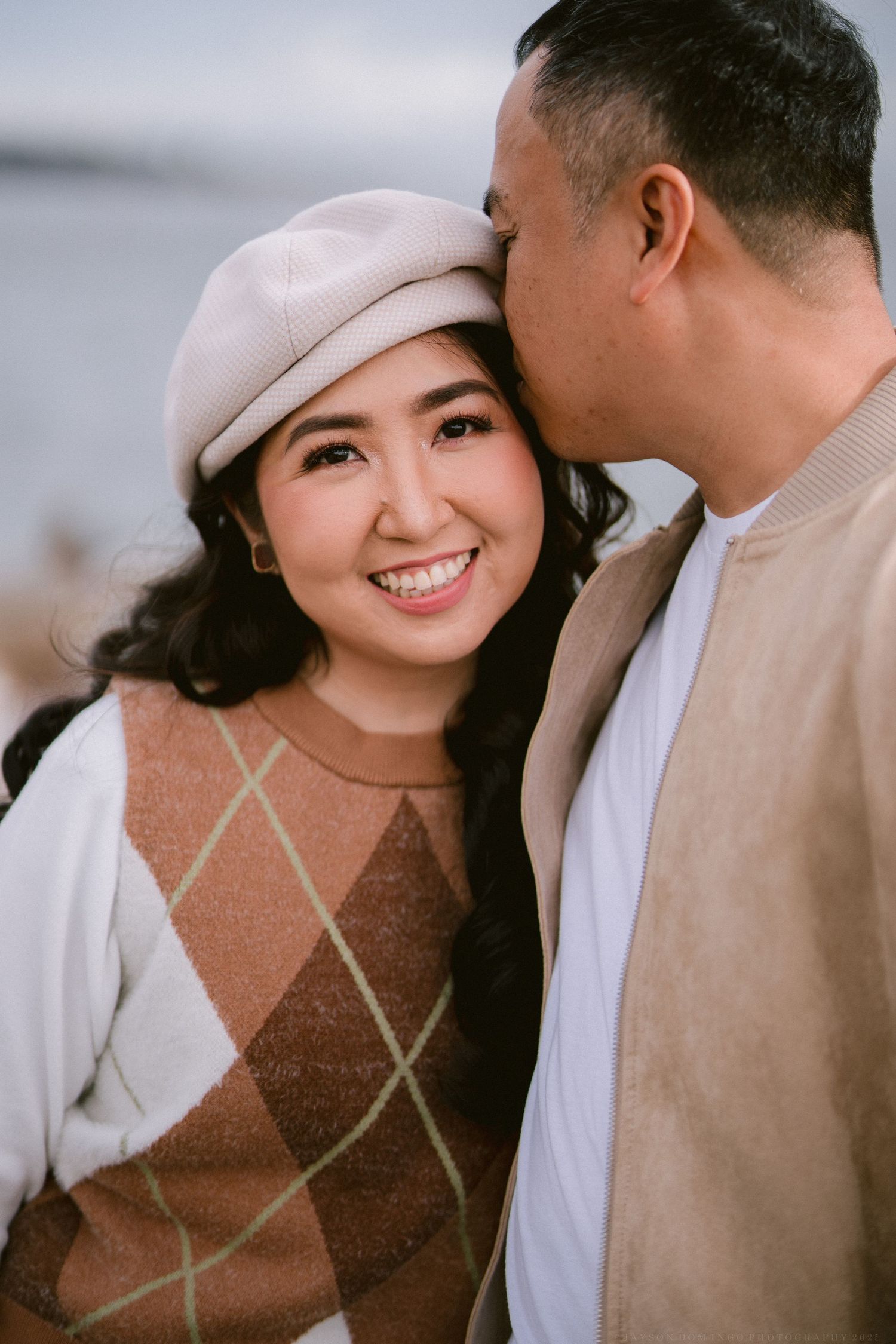 A romantic couple in beige and white outfits share tender moments in a sequence of intimate portrait photos.