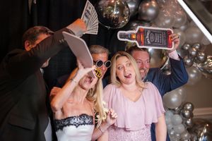 A series of candid party photos showing people dancing and having fun at an event with silver balloons.