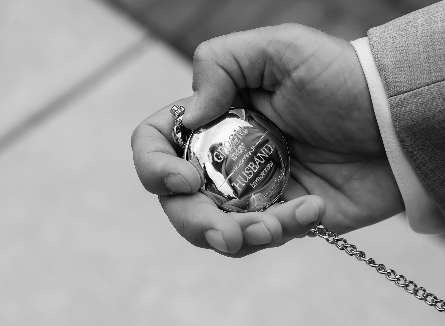 Black and white photo series showing hands exchanging a ring in sequence.