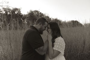 A romantic black and white photo capturing an intimate moment in nature.