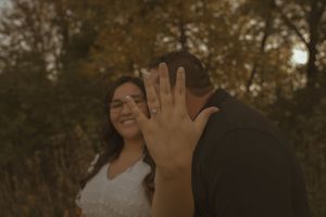 A candid moment of happiness between a couple in a natural setting.