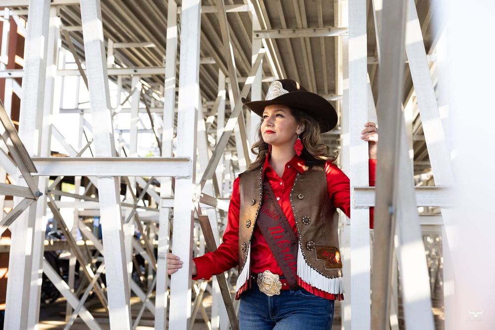 Western-themed architectural details with white wooden beams and rustic styling. Nebraska Pro Rodeo PRCA Rodeo Photographer Dakota Cardenas