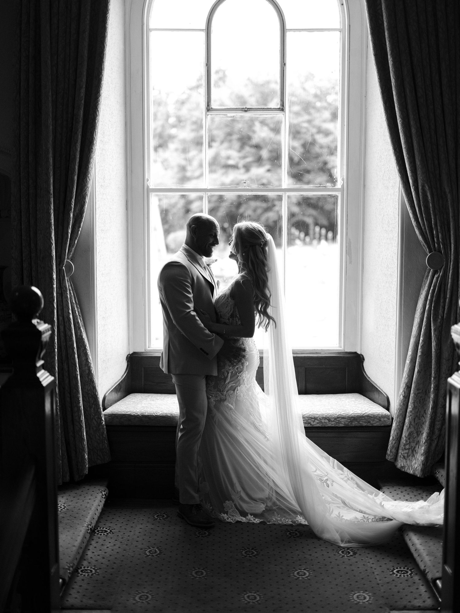 bride and groom at Court Colman on the stairs