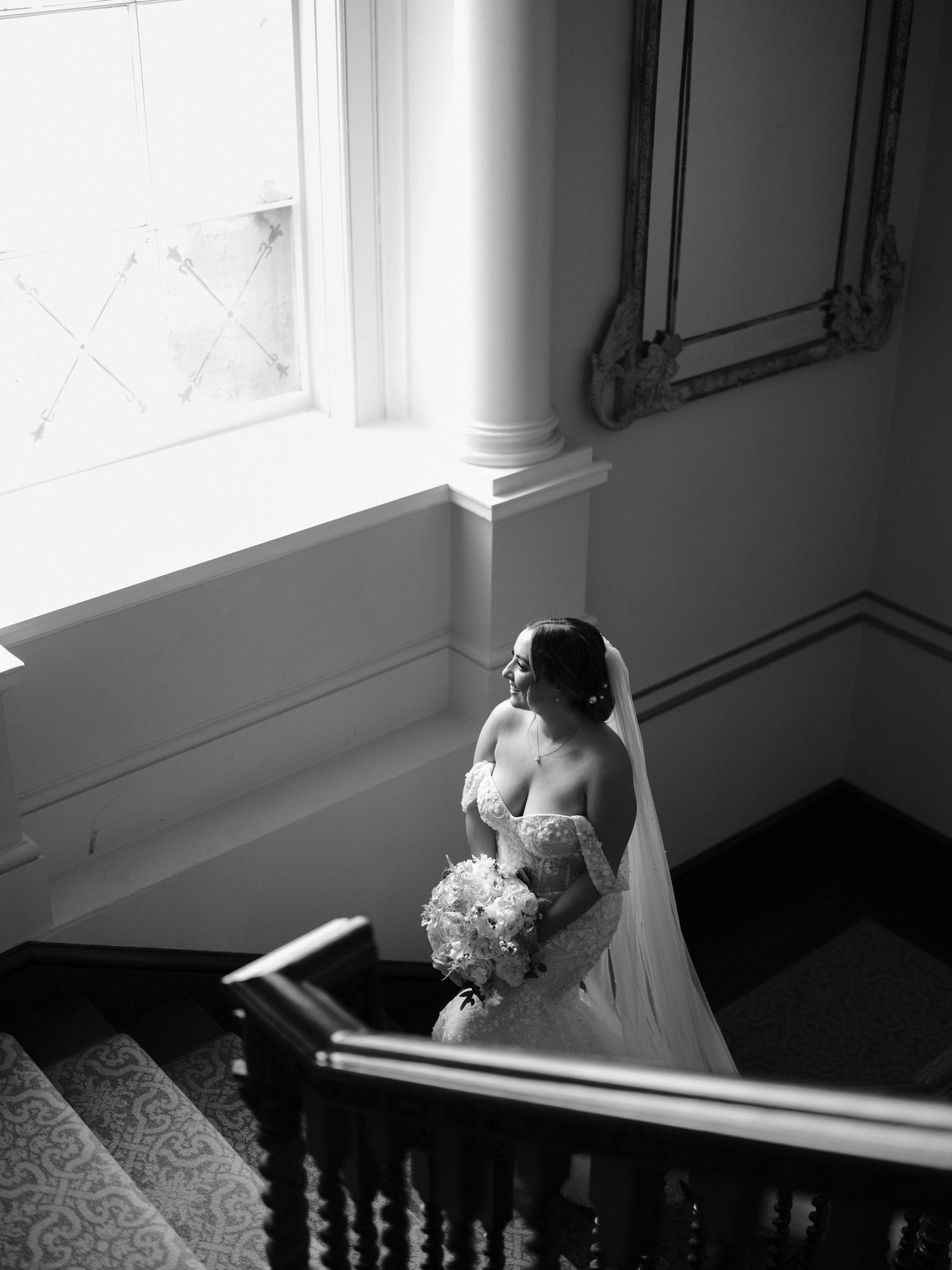 stunning bride in black and white on stairs at Hensol Castle