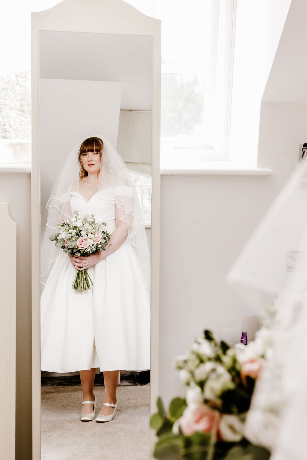 Bride in mirror Barnett Hill Hotel