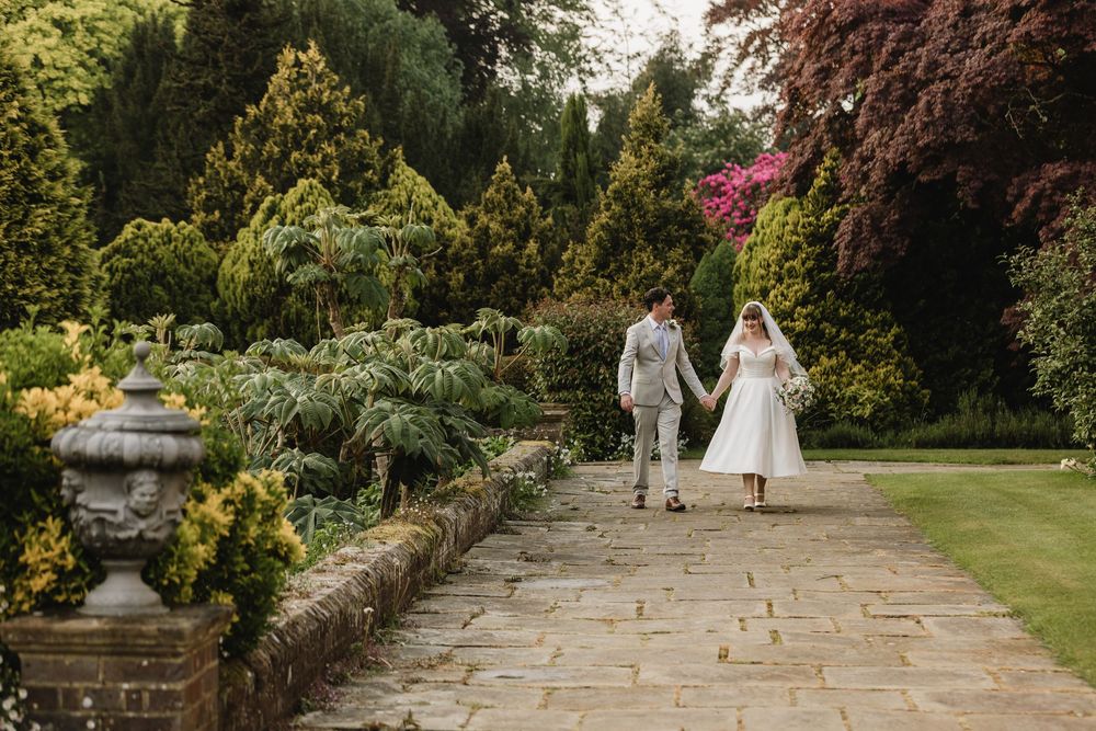 Wedding couple in garden at Barnett Hill Hotel