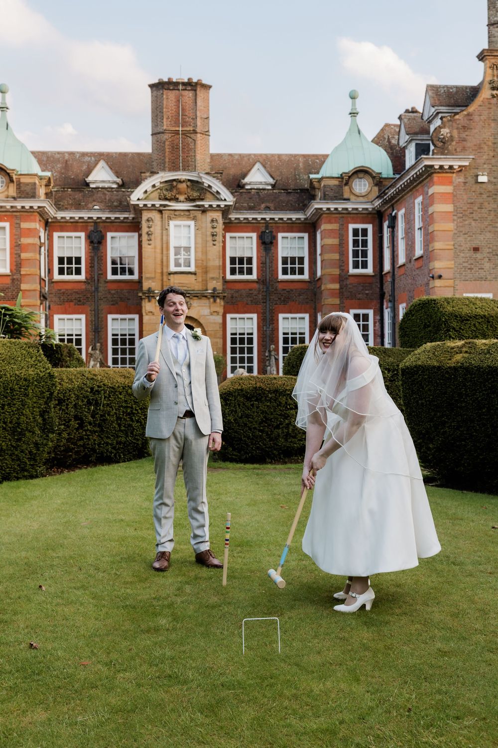 Couple playing croquet Barnett Hill Hotel