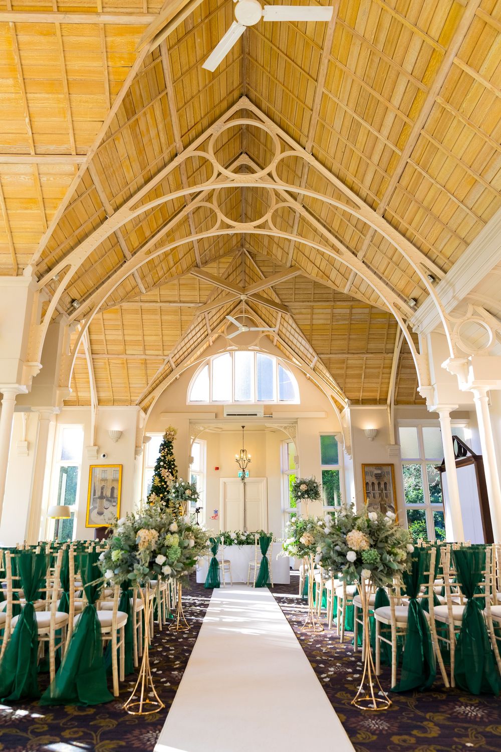 Wedding ceremony setup at Audley's Wood Hotel with green and white floral arrangements
