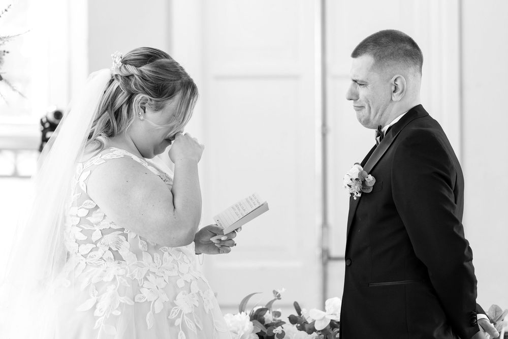 Bride and groom overcome with emotion while reading heartfelt vows at their Audley’s Wood Hotel ceremony.
