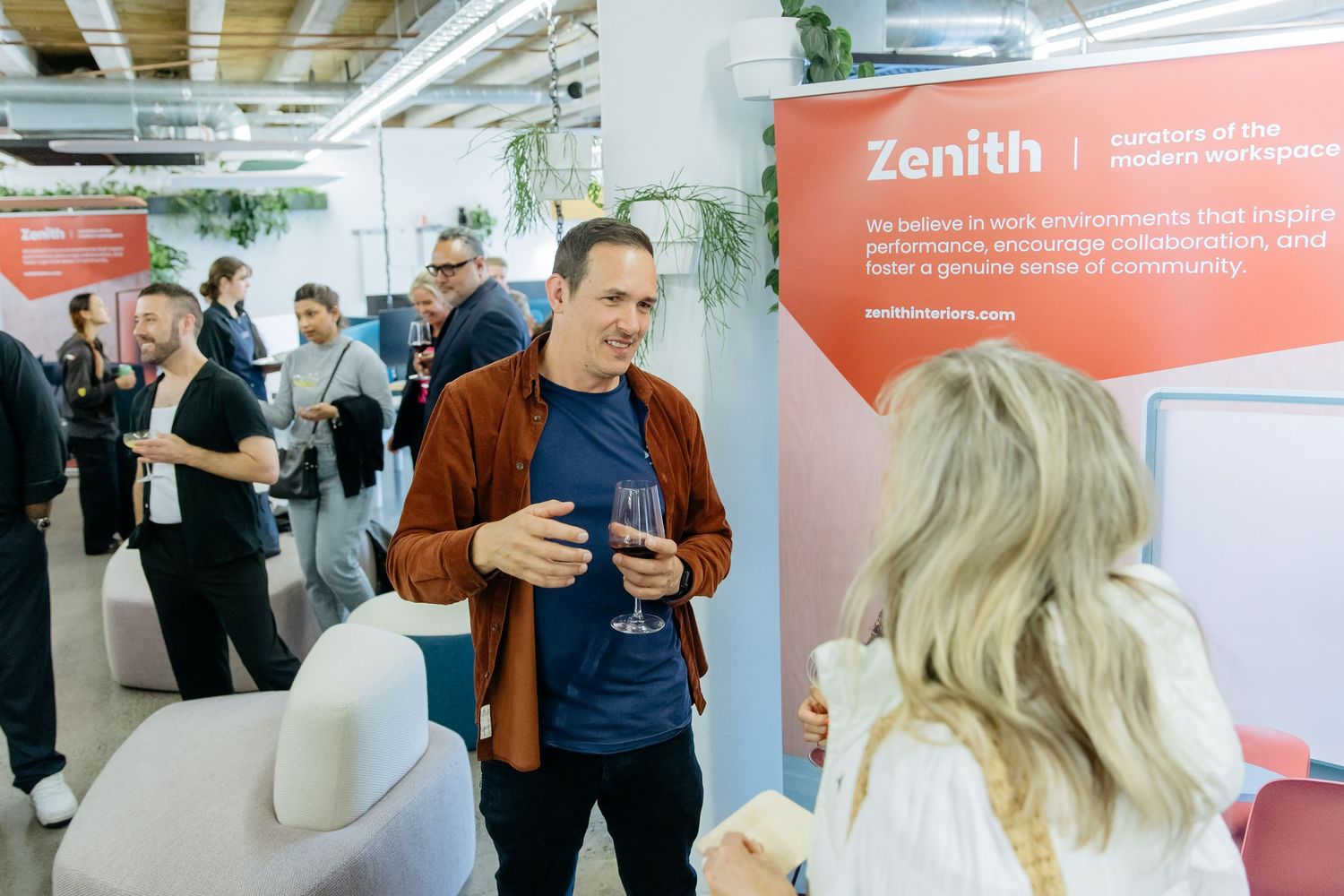 Guests networking and interacting at a panel discussion event