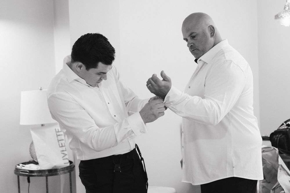 A series of black and white photos showing people in white shirts preparing and getting ready before a formal event.