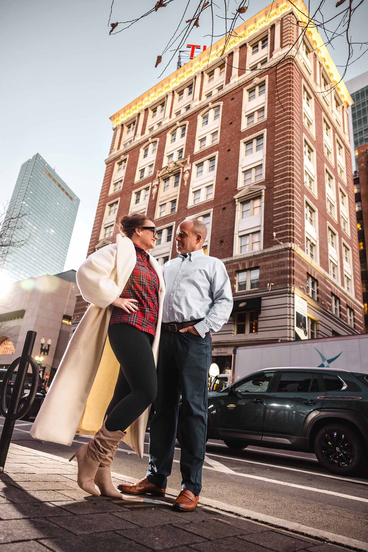 Couple portrait in front of Lenox Hotel Boston façade on Newbury Street at sunset