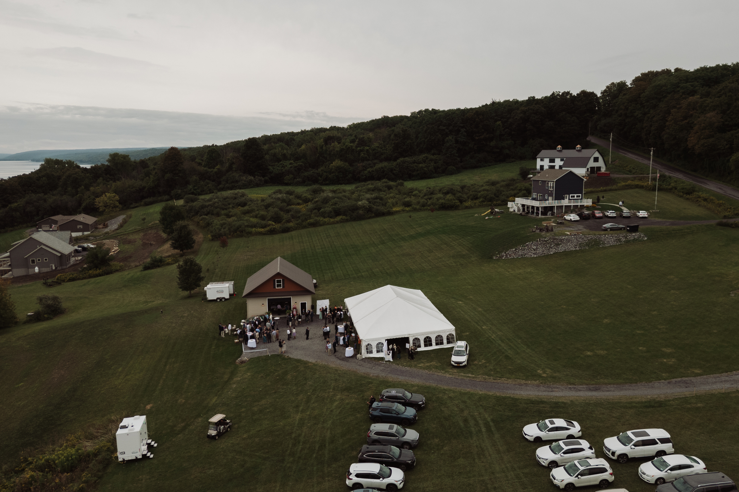 Aerial view of Bridget and Joseph’s lakeside wedding reception in the Finger Lakes region of New York