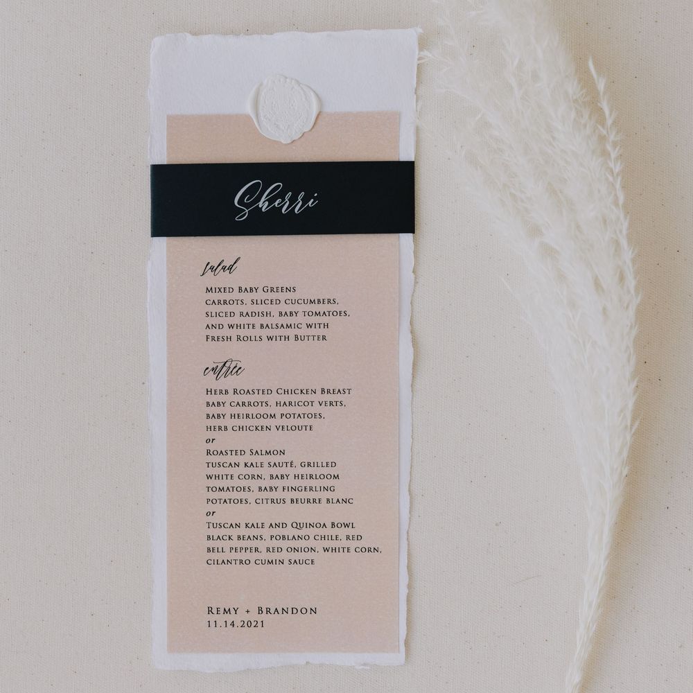 Elegant personalized wedding menu card for guest Sherri featuring blush background with black ribbon detail.