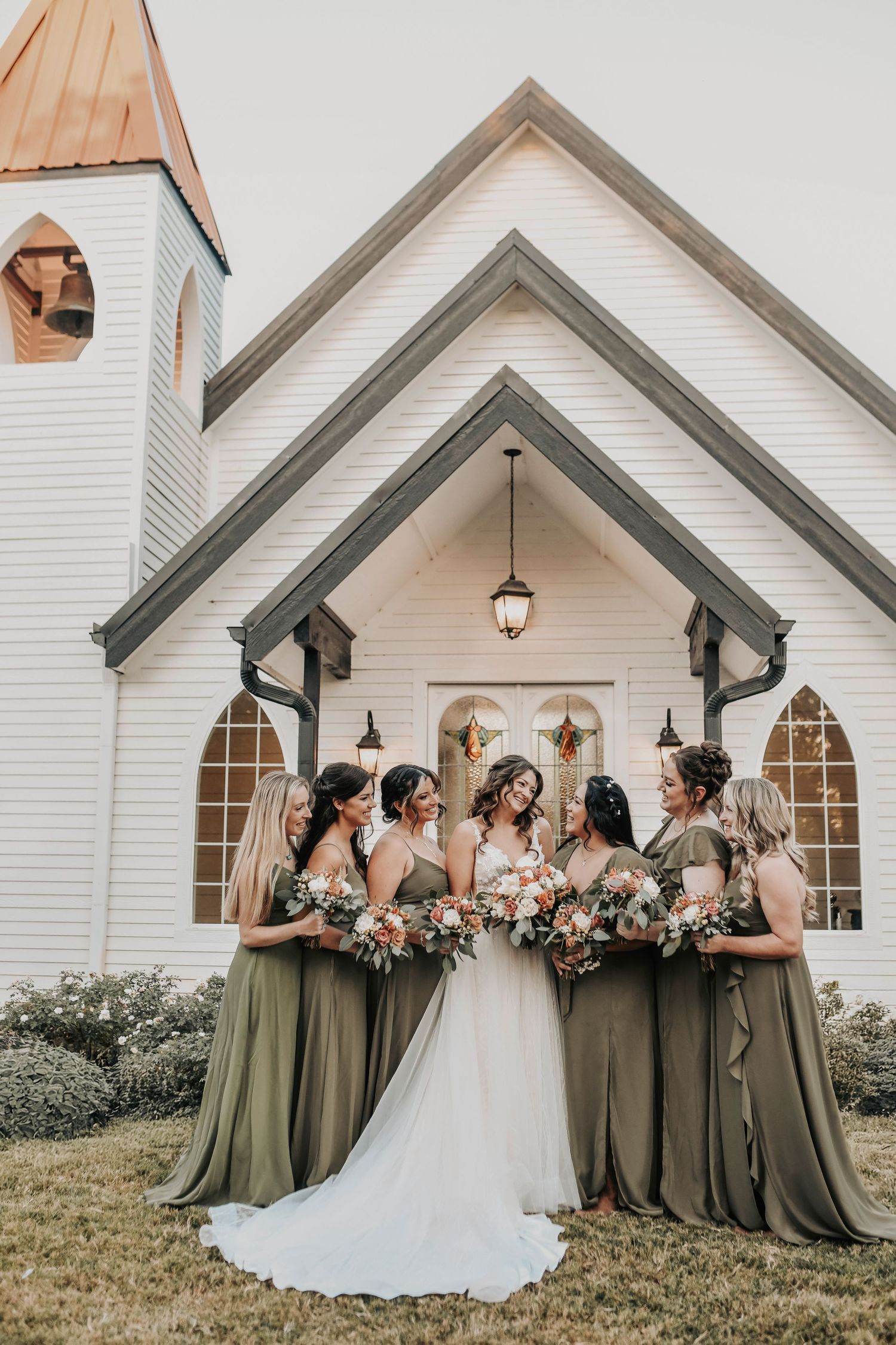 Bride with bridesmaids North Texas barn wedding