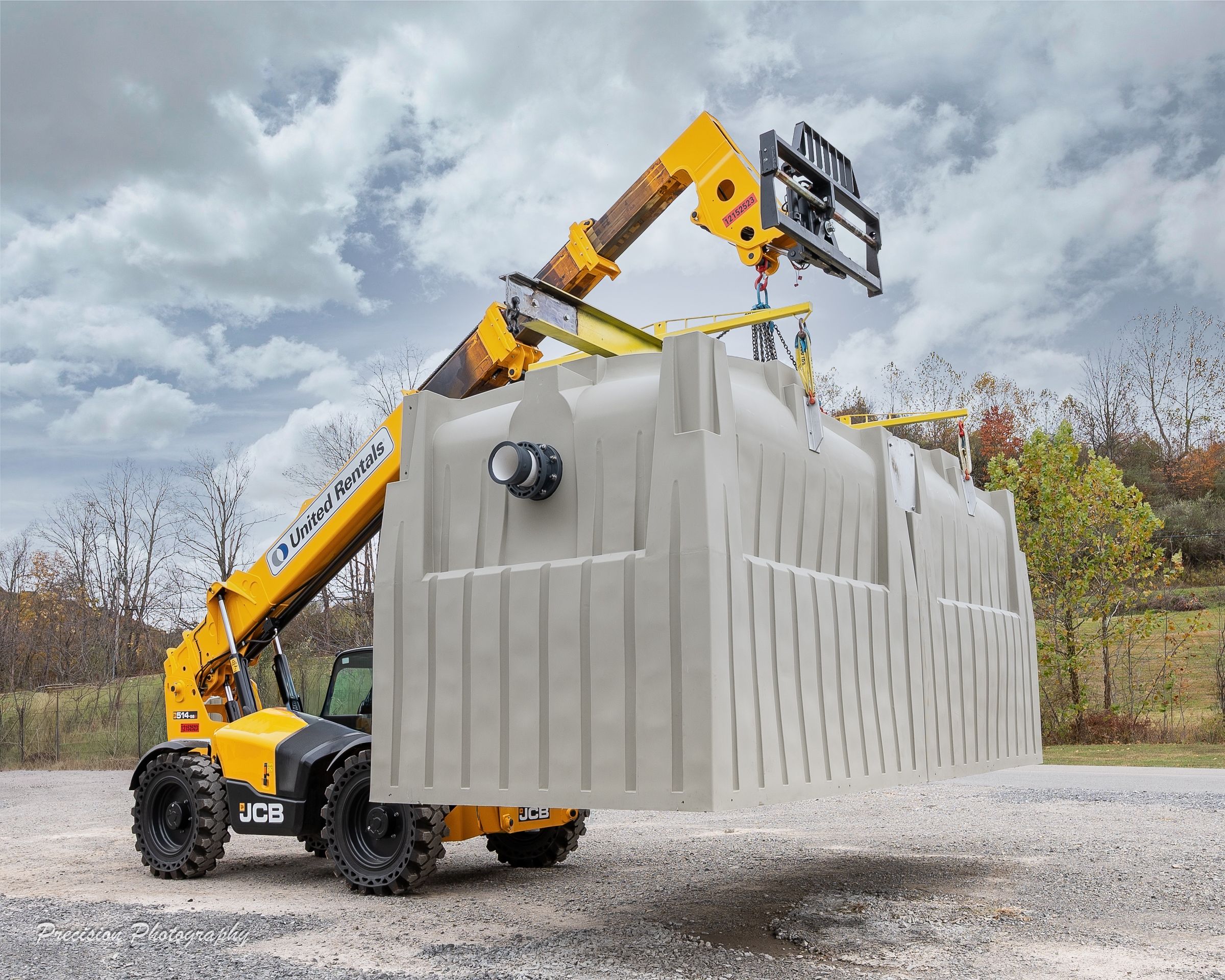 Yellow crane lifting and installing large cooling tower at Delta Cooling Towers.