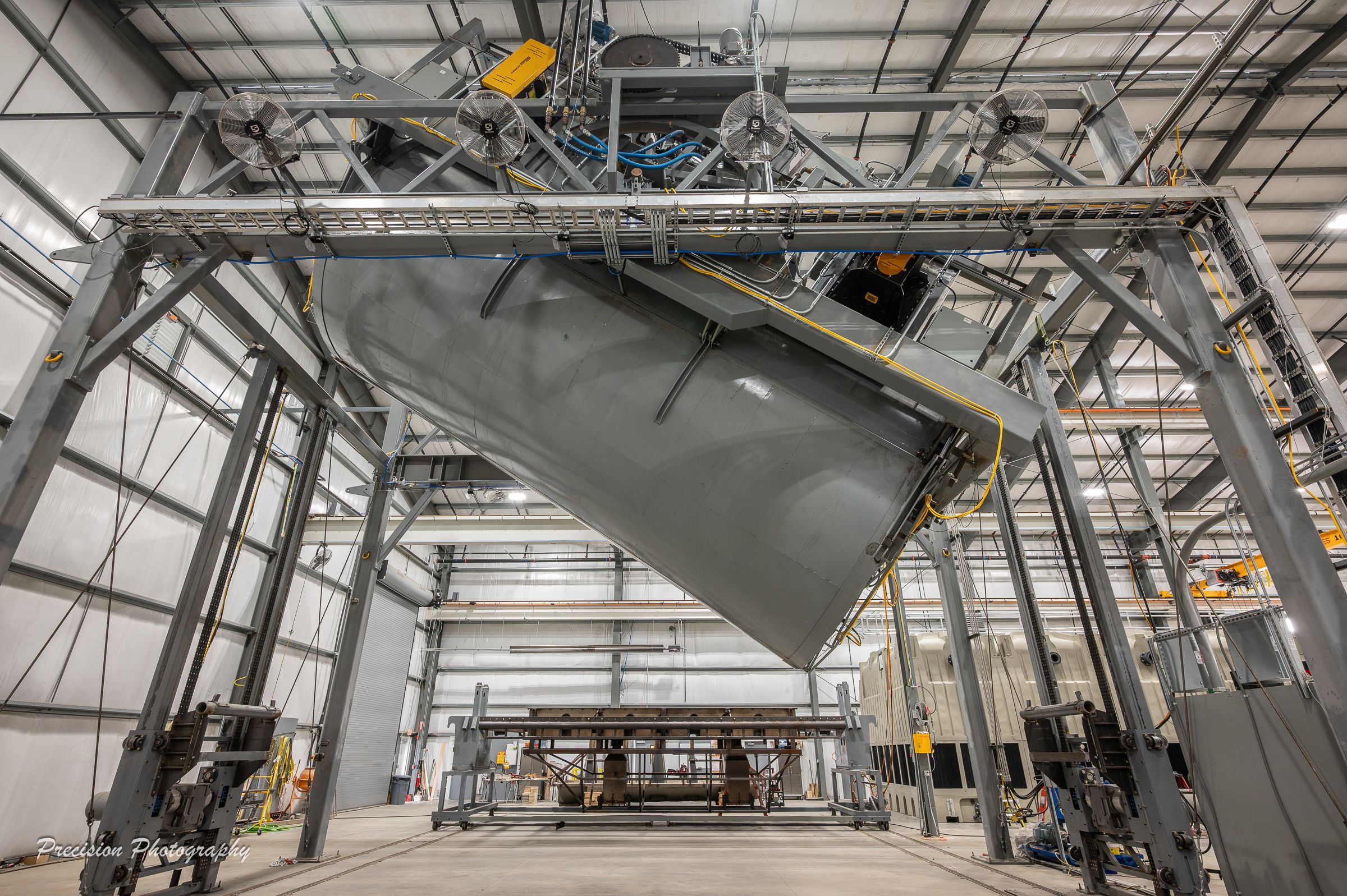 Industrial warehouse interior with metal framework and mechanical equipment at Delta Cooling Towers.