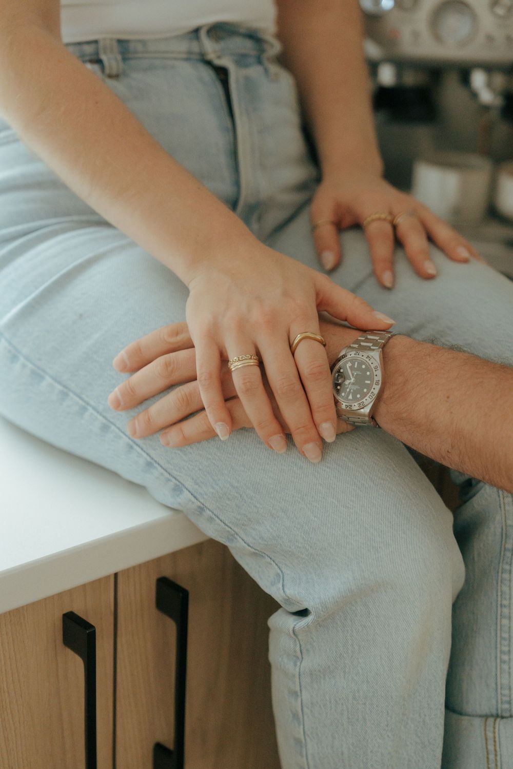 Close-up shots of hands with engagement ring showing progressive moments of affection and connection.