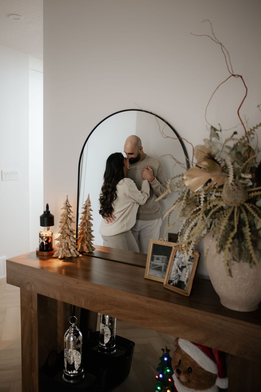 a couple in their new home posing for a photoshoot in red deer alberta