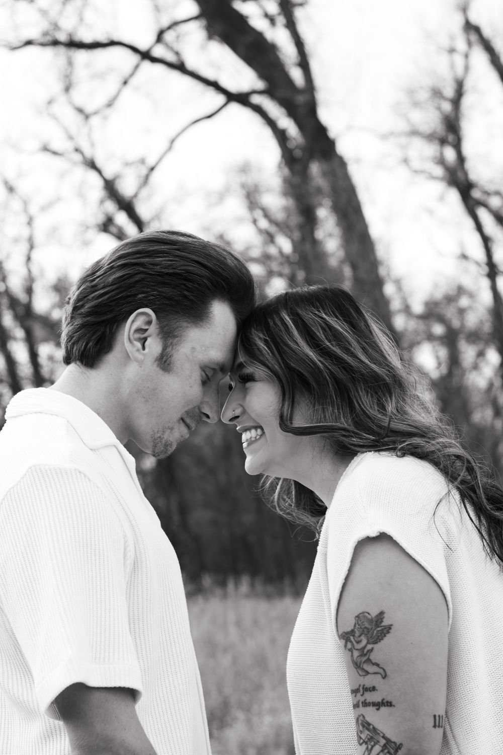 Black and white photo series of a couple sharing tender moments outdoors.