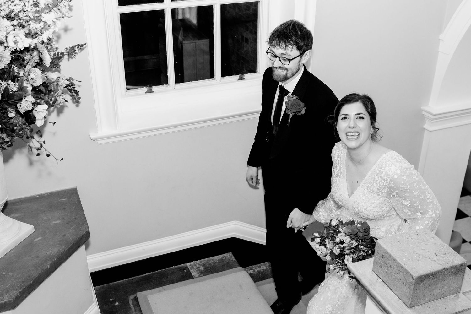 A black and white collage of wedding photos showing romantic moments between a couple on their special day.