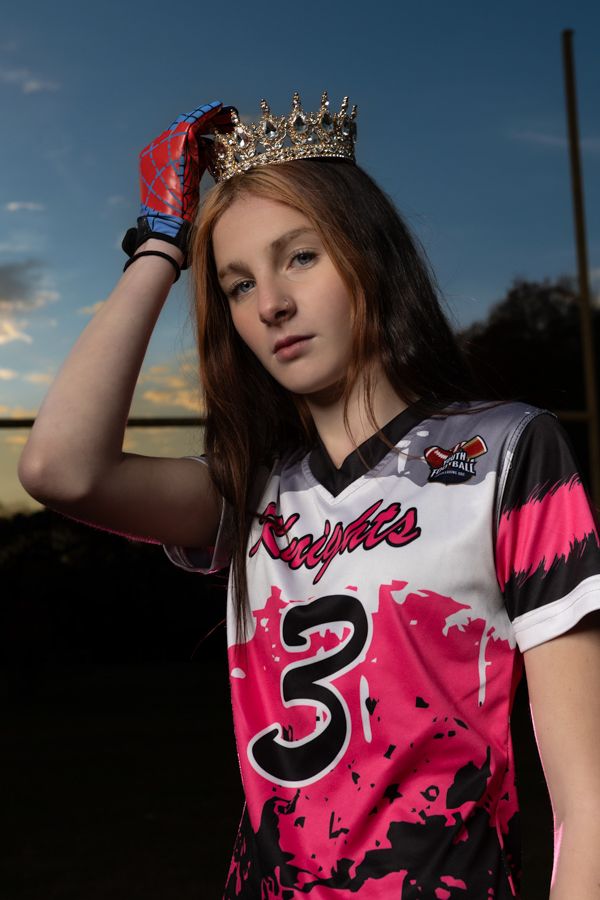 girl flag football player wearing a crown wearing pink gloves and pink shirt gloucester virginia dramatic sports photographer