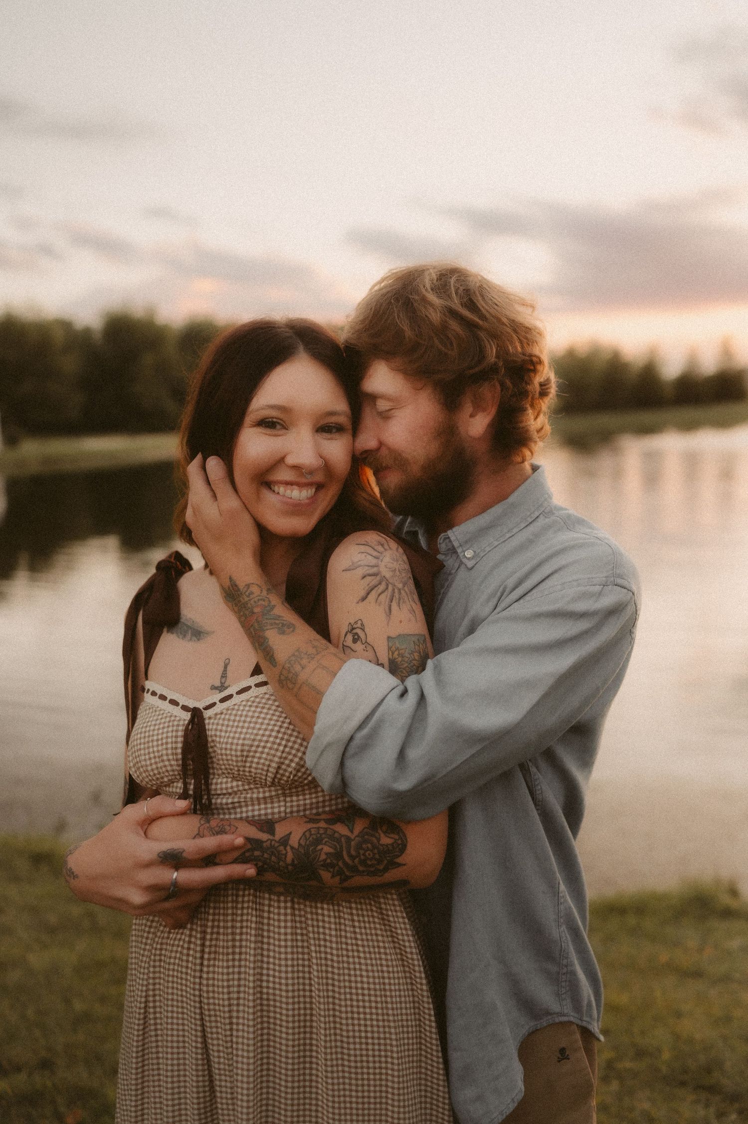 Indiana Couples Storytelling Photographer // Candid anniversary photos by a lake at sunset with natural expressions and warm lighting.