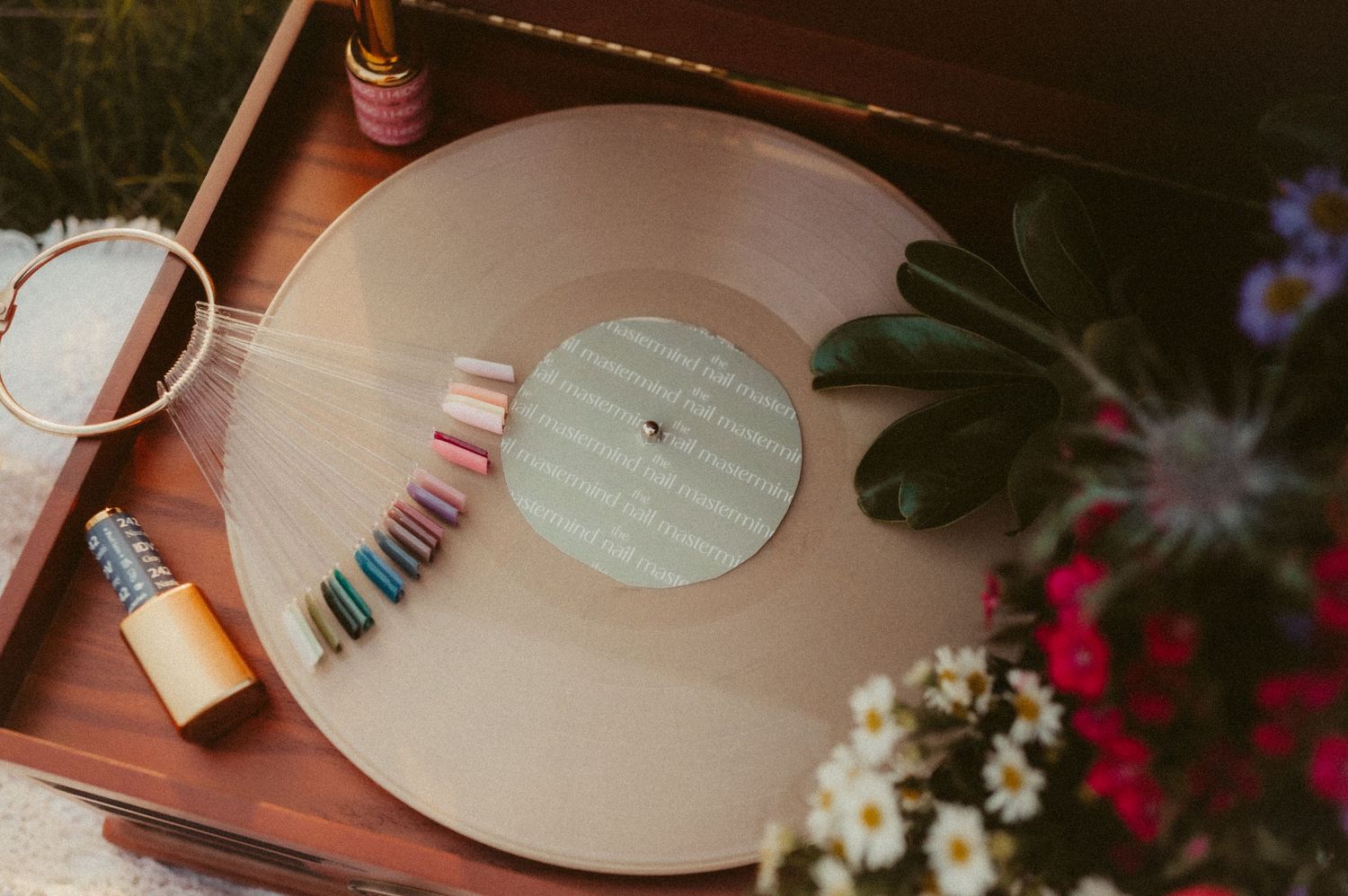 Vintage vinyl records and decorative elements arranged on a wooden surface.