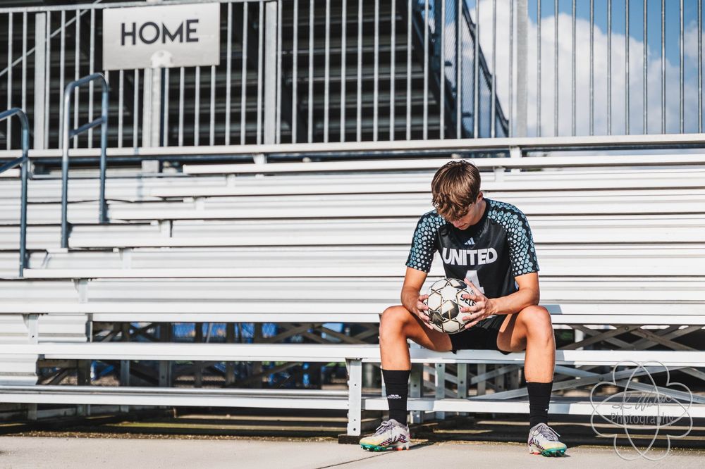Soccer player on bleachers